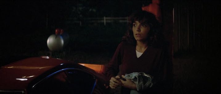 Karen Allen in a tense nighttime moment next to a car in Starman. NOTE: Stills shown are for promotional use only and not from the 4K UHD.
