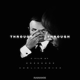 Cover artwork with man covering his face and woman in profile, black background, text reading "Through and Through – A film by Grzegorz Królikiewicz."