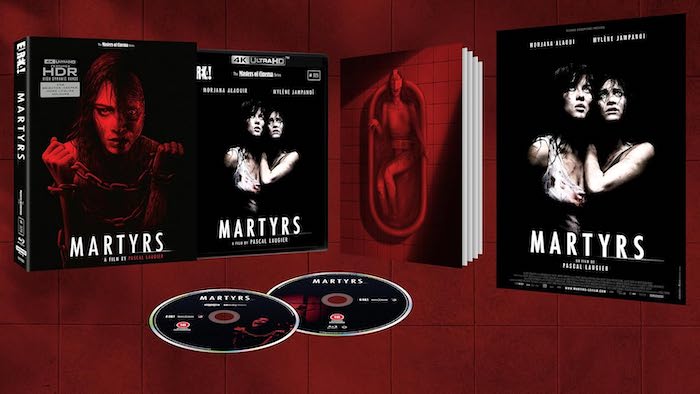 A promotional display of the Eureka! Masters of Cinema 4K UHD release of Martyrs. The image showcases the outer slipcase, Blu-ray case, two disc trays, a booklet with a red-tinted image of a woman curled in a bathtub, and a folded poster featuring the two main characters embracing.
