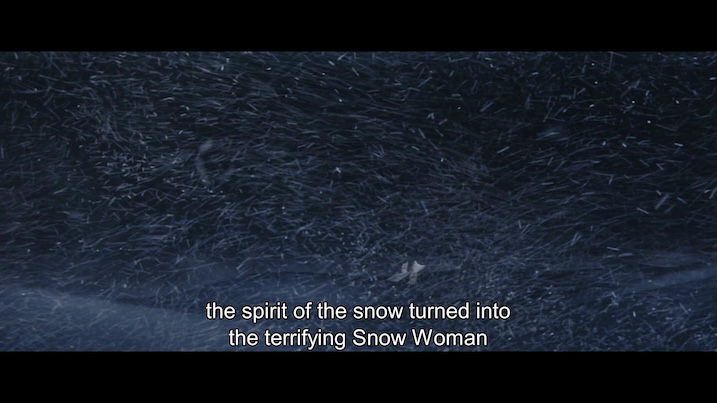 Snowstorm scene – Scene from The Snow Woman (1968) showing a fierce blizzard with English subtitle reading, “the spirit of the snow turned into the terrifying Snow Woman.”