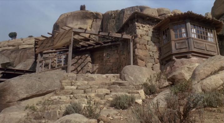 Stone-built house location featured in the final act of The Man Called Noon (1973), surrounded by rocky terrain and sparse vegetation.